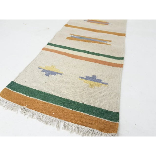 Vintage Indian Woolen Rug, in Good conditions. Designed 1950 to 1959 This piece is attributed to the mentioned...