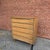 This mid-century modern walnut chest features five spacious drawers with sculpted integrated drawer pulls that create a...