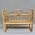 A charming vintage bamboo and rattan wall shelf with a built-in towel bar along the front, scrolled arm details, and a...
