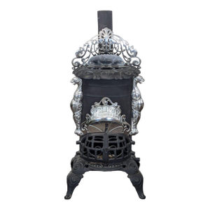 Vintage Iron Parlor Stove With Ornate Details