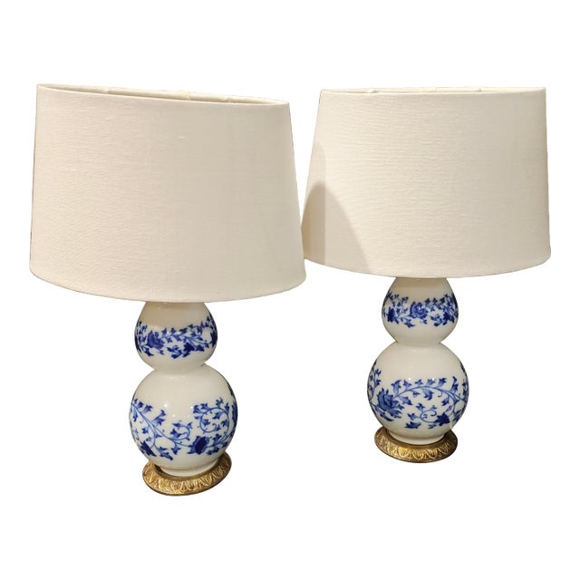 Mid 20th Century Chinoiserie Blue & White Double Gourd Porcelain Lamps on Gilt Lotus Bases - a Pair For Sale