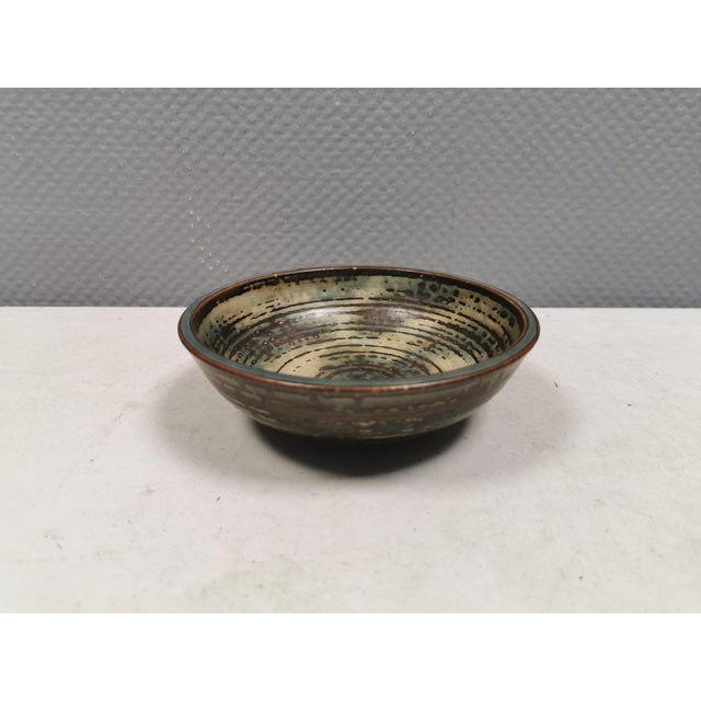 A very rare and beautiful bowl with Sung glaze by Kresten Bloch for Royal Copenhagen, 1963. It is stamped and signed, and...