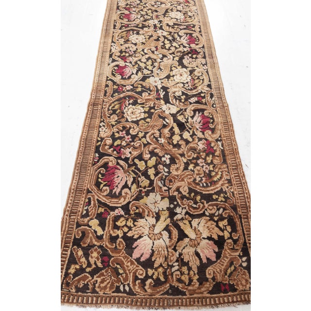 Steeped in the opulent traditions of the Caucasus, this antique Karabagh runner (size adjusted) from circa 1880 is a...