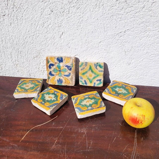 Set of six square glazed earthenware tiles with polychrome hand-painted underglaze decoration. This set features superb...