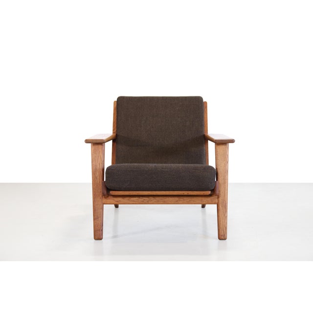 A beautiful classic by hans j. Wegner for getama from denmark. This model, ge290, is an armchair made of solid oak. A...
