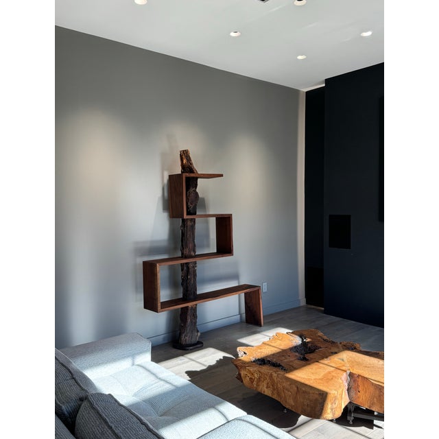 This one-of-a-kind sculptural bookshelf is handcrafted from solid walnut in the studio of artist and woodworker Larry...