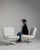 A collection of mid-century Space Age swivel chairs characterized by rounded forms and functional bases. These chairs...