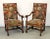 Pair of French os du mouton walnut armchairs with needlepoint upholstery. No maker's marks. Seat measures: 18.5" H.