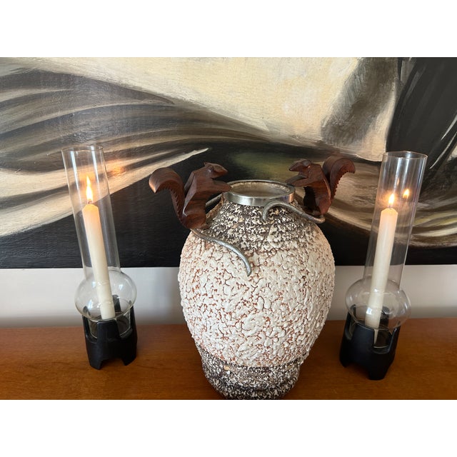 André villian ceramic vase, silvered bronze trim on the neck decorated with 2 wooden squirrels. Height 34 cm Diameter at...