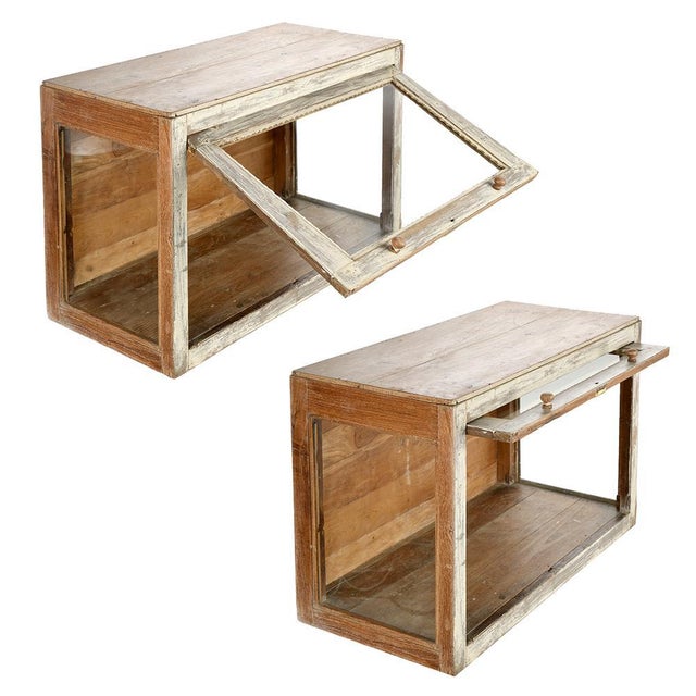 This superb solid wood display case, adorned with an aged white patina, is an authentic piece that combines rustic charm...