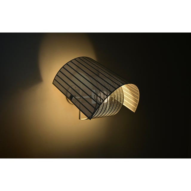 Metal and plastic wall lamp designed by Mario Botta, Shogun model. Stamped Artemide, Mario Botta. Wear consistent with age...