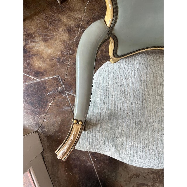 Painted Louis XVI Fauteuil, lined in vintage blue leather front and back, and cut velvet on the seat. Please note the...