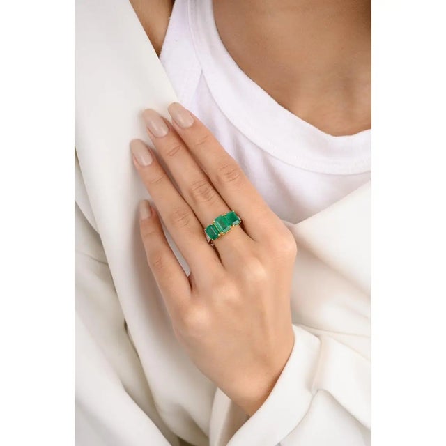 Genuine Three Stone Emerald Ring with Diamond Set in 18K Gold featuring natural emerald of 4.14 carats and diamonds of 0.2...