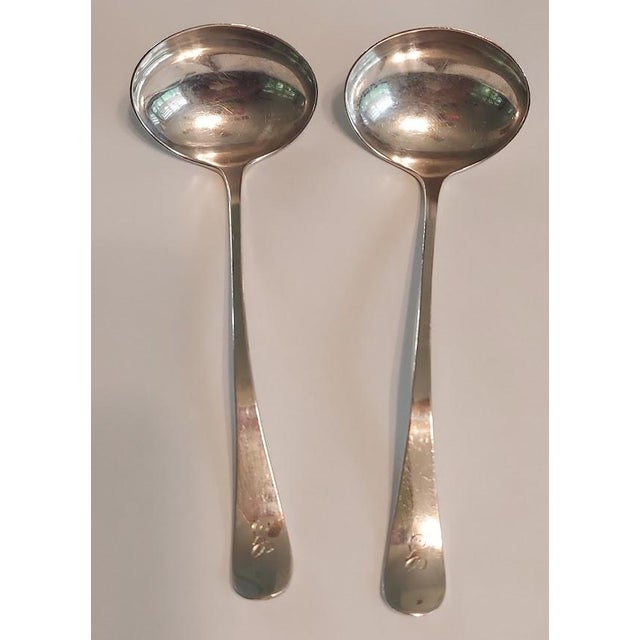 Attractive matched pair of antique Paye & Baker Manufacturing Co. sterling silver sauce/cream ladles, dating to the early...