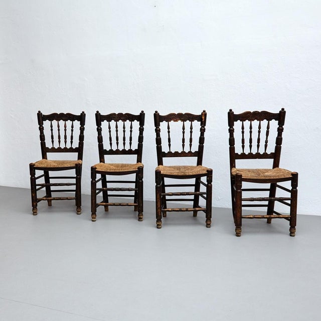 Set of four rustic wood french chairs. Manufactured in french, circa 1950. In original condition with minor wear...