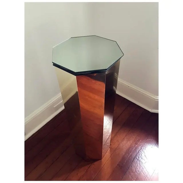 This 1970s Hollywood Regency octagonal pedestal features a geometric design with a solid pedestal base. Its sharp lines...