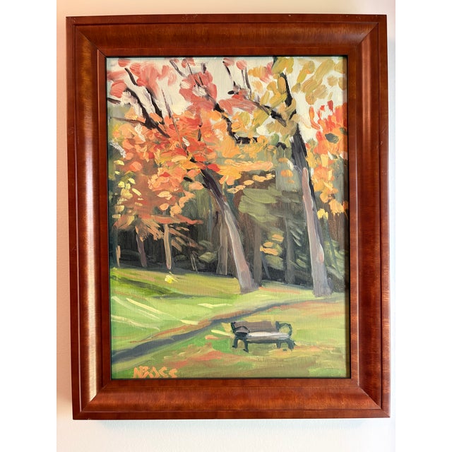 A seasonal but timeless observation of a park with a bench, sitting all alone but not lonely.