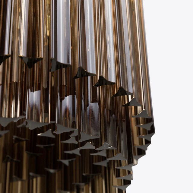 Layer upon layer of mid-century inspired pink or amber triedri style glass prisms make our Amaro chandeliers the perfect...