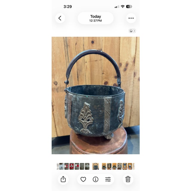 This handled pot has a beautiful patina. Very old, very heavy for its size and in great condition. There is a splatter of...