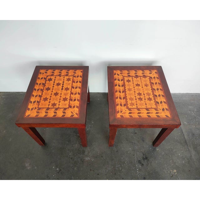 Set of two matching arts and crafts side tables circa 1940s. Beautiful geometric pattern of stars and diamonds framed with...