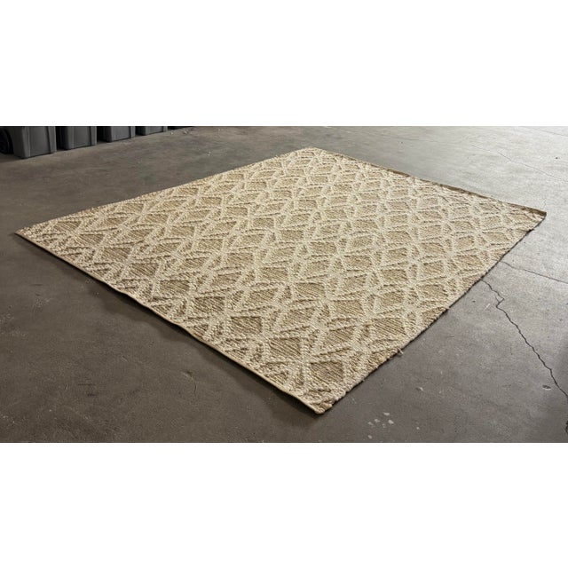 Design Plus Gallery presents a 9ft × 11ft 11in Geometric Wool Jute Area Rug from West Elm. This textured area rug...