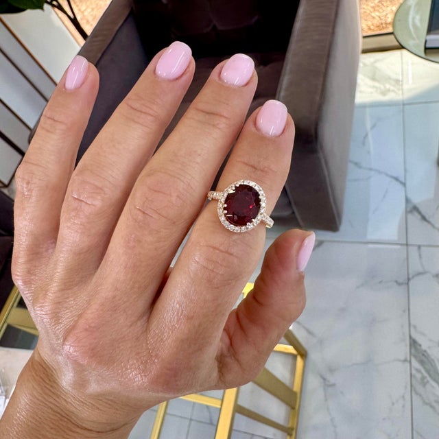 Gender: Ladies Metal Type: 14K Rose Gold Ring Size: 5.5 Weight: 5.66 grams One ladies 14K rose gold diamond and garnet...