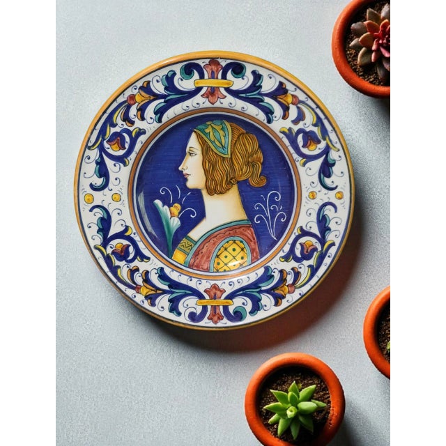 This vintage Italian Deruta Majolica hand painted Renaissance portrait decorative plate is a beautiful collector's item...