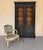 A handsome late 19th-century French Napoleon III style ebonized bookcase, distinguished by its elegant proportions and...