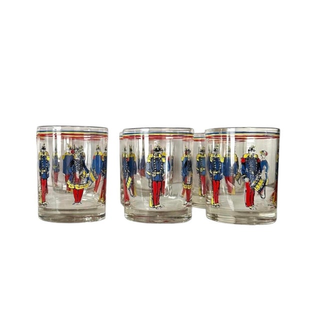 A charming, vintage set of French Soldier barware glasses for Neiman Marcus. Each features French soldiers encircling the...