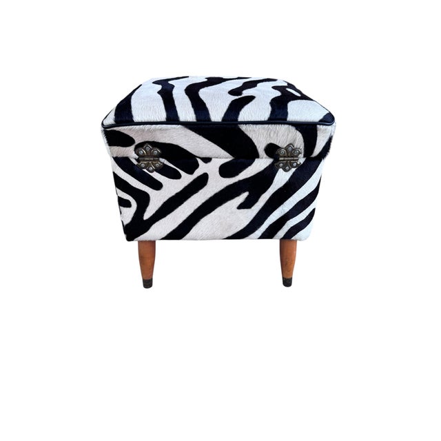 Vintage Storage Ottoman Newly Reupholstered in Zebra Cowhide Spice up your space with this zebra print upholstered...