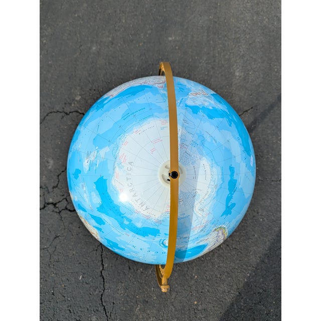 This stunning Mid-Century Globe on a handcrafted wooden floor stand will add a touch of timeless sophistication to your...