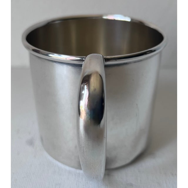 This lovely 1950's vintage large hallmarked sterling silver child's cup is not monogrammed and has a gold washed...