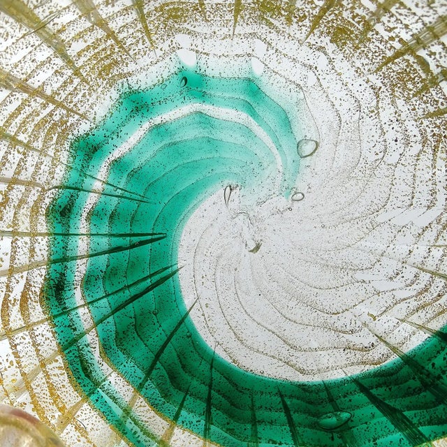 Beautiful vintage Murano hand blown emerald green, with gold flecks Italian art glass bowl. The bowl has a painterly...