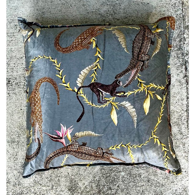 Elevate your interior with this exquisite vintage "River Chase" printed velvet pillow, a piece that masterfully blends...