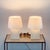 Pair of 'Bloc' parchment lamps with parchment paper shades by Design Frères. The overall dimensions are 10 in. diameter x...