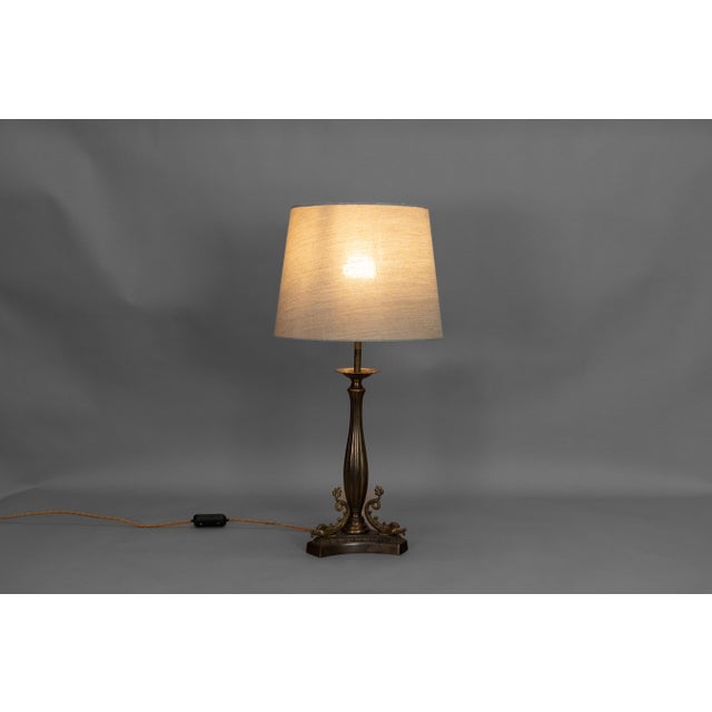 Solid brass table lamp with fish decoration. Shade not included. France circa 1900. UK Plug (up to 250V).The wiring of...