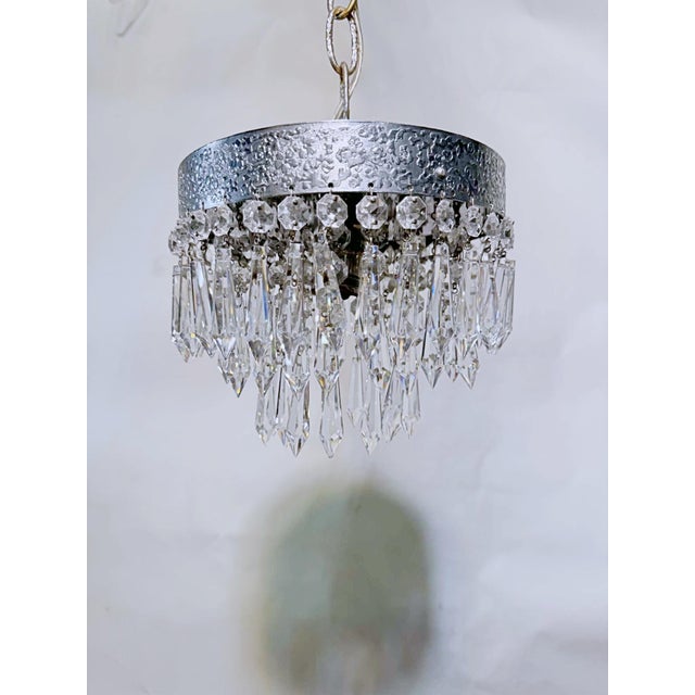 This exceptional vintage chandelier is an absolute ice-box of shimmering brilliance, perfectly capturing the crisp, high-...