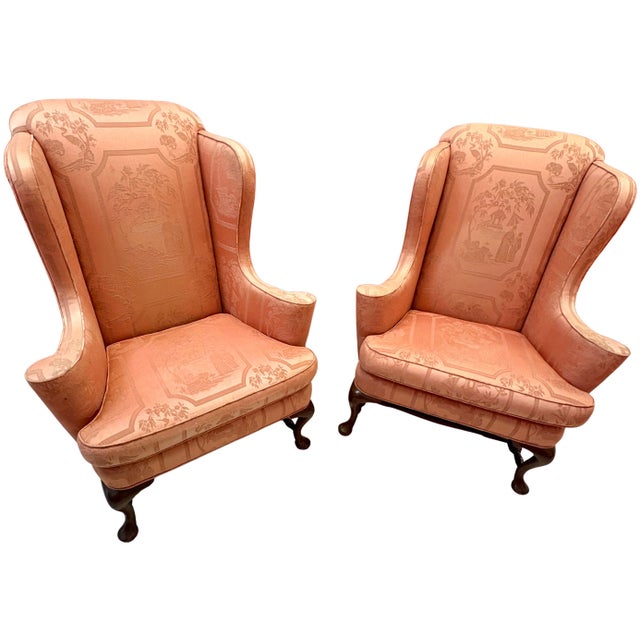 Circa 1960s Queen Anne style wingback chairs featuring custom coral Chinoiserie jacquard upholstery, tall shaped wings,...