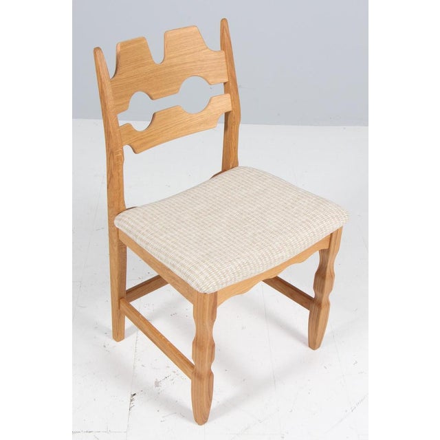 Set of striking dining chairs by henning kjærnulf, made of oak and holiday birillino sand/white fabric from c&c milano...