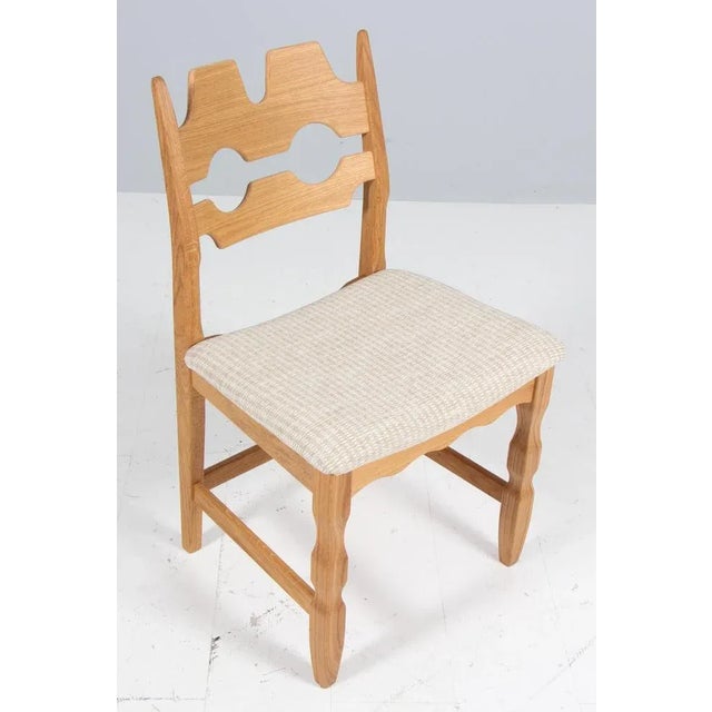 Set of striking dining chairs by henning kjærnulf, made of oak and holiday birillino sand/white fabric from c&c milano...