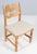 Set of striking dining chairs by henning kjærnulf, made of oak and holiday birillino sand/white fabric from c&c milano...