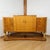 An art deco sideboard by harry & lou epstein. Burr walnut and satin birch veneered with original bakelite handles....