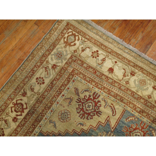 An early 20th century highly decorative Persian Malayer room size rug, circa 1920, measures: 7'10" x 12'9''.