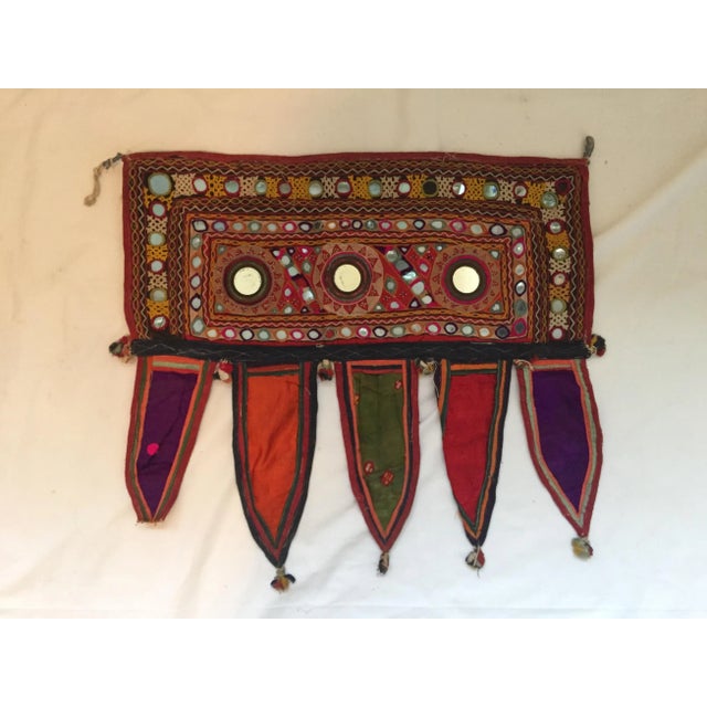 A vintage hand-embroidered mirrored cotton door or window valance with ribbon tassels. One of a kind. Purchased in Jaipur,...