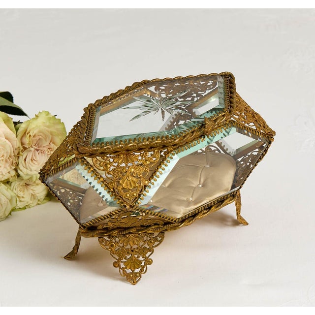 An absolutely stunning antique paneled glass jewelry box. This quite large box has all of the bells and whistles. It has...