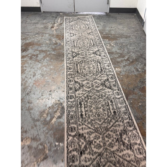 Design Plus Gallery presents a Safavieh Adirondack runner rug with an ornate medallion pattern and detailed borderwork....