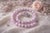 An elegant natural kunzite bead necklace measuring 18 inches (45.7 cm) in length. The smooth, round beads measure...