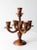 This is a mid 20th century wooden candelabra. The turned wood candlestick holder holds five tapers.