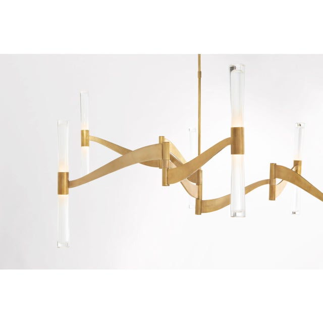 Brenta Grande Chandelier in Hand-Rubbed Antique Brass with White Glass Designer: AERIN Fixture Height: 32" Min. Custom...