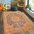 This stunning hand-painted rug features an elegant traditional design with a vibrant, artistic touch. The centerpiece...